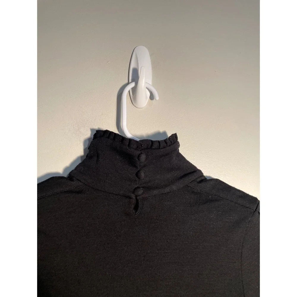 Diane von Furstenberg Black Wool Turtleneck‎ Ruffle Hem Top Size 10 Quiet Luxury